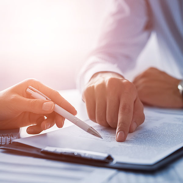 Human hands working with documents at desk